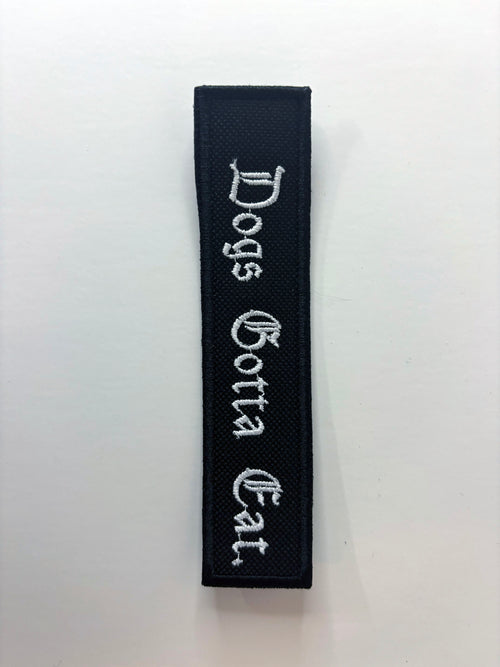 Dogs Gotta Eat. Embroidered Flight Tag