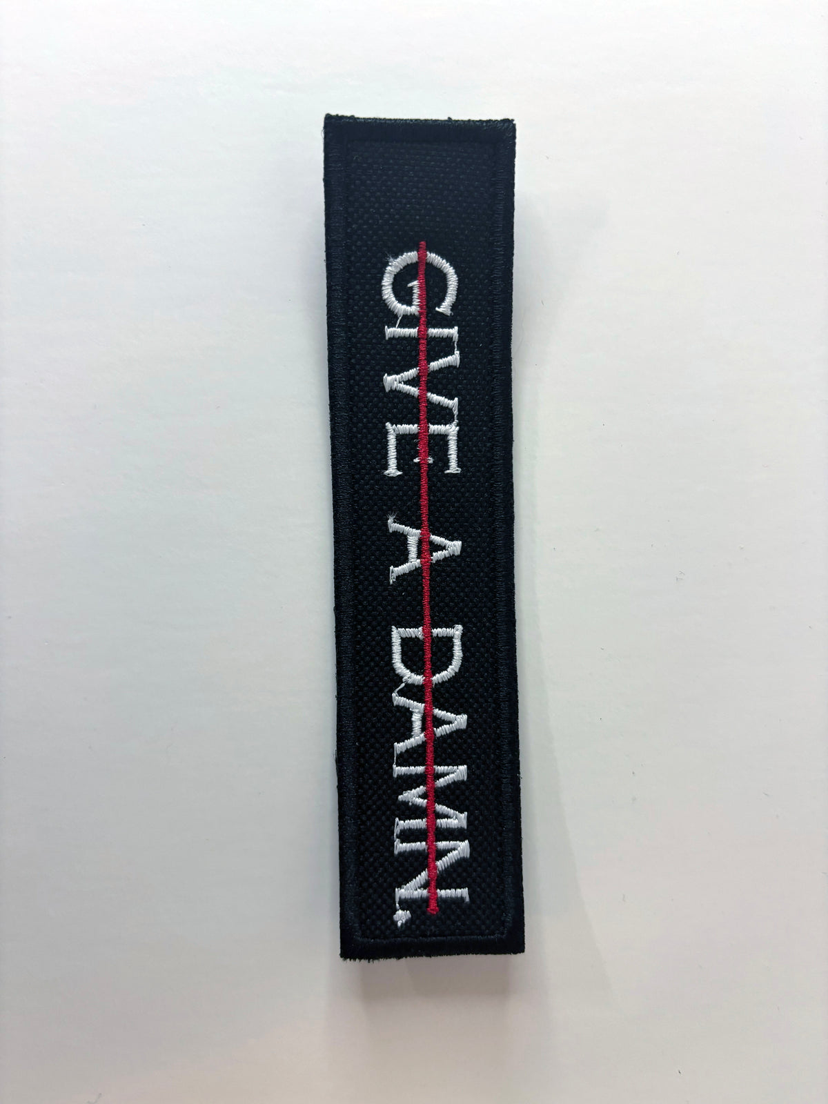 Give A Damn. Embroidered Flight Tag